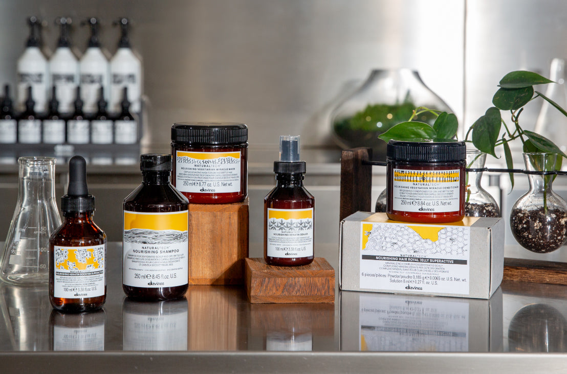 Davines Naturaltech NOURISHING products sitting on a lab table
